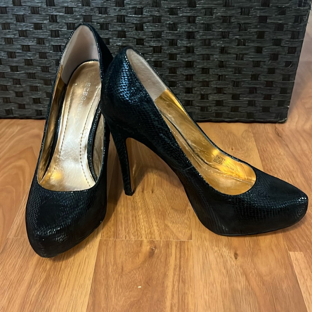 BCBGeneration black snake skin platform pumps. Size 7